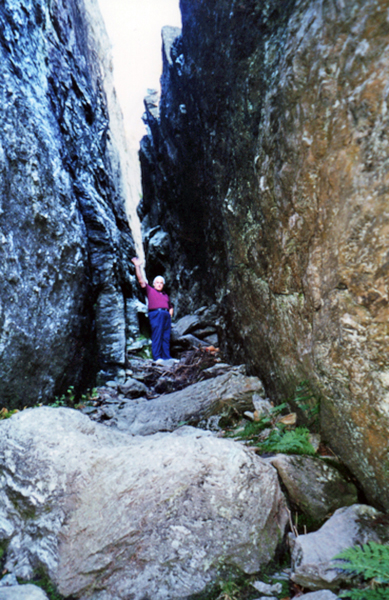 Lee Duquette in-between big boulders